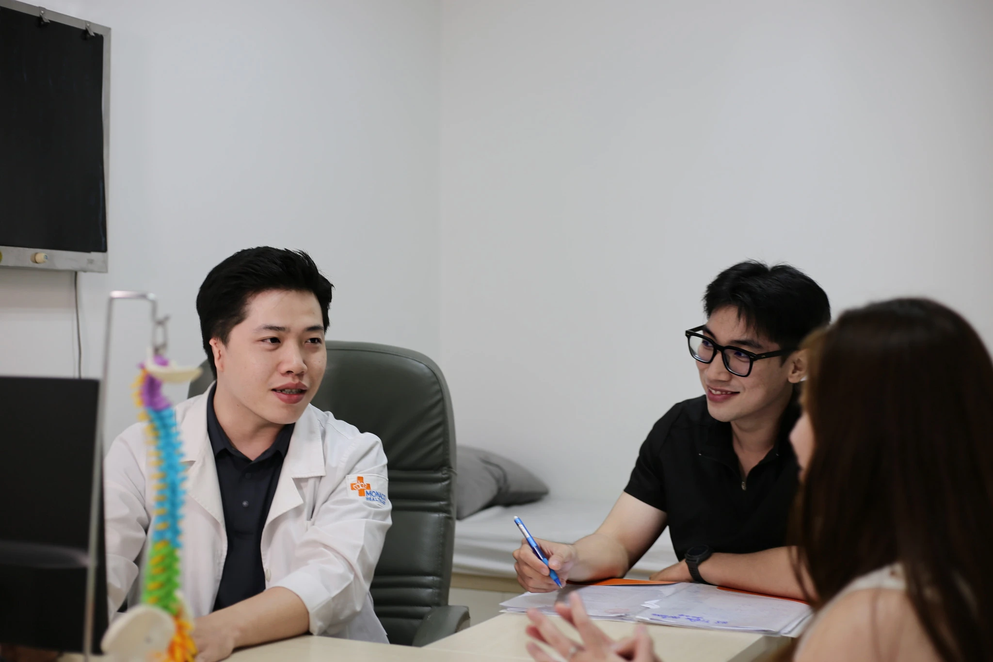 Professional physiotherapy session — a therapist treating a patient